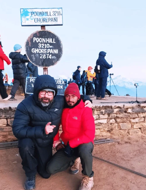Senior Trekker with a guide at Ghorepani Poon Hill